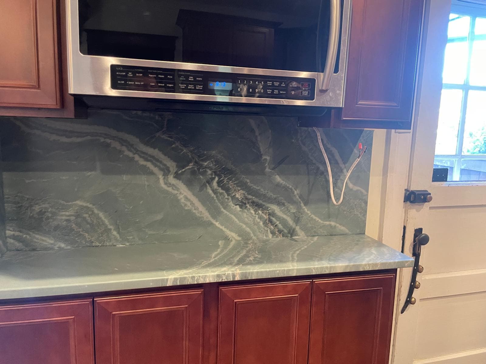 Green Quartzite with Cherry Cabinets
